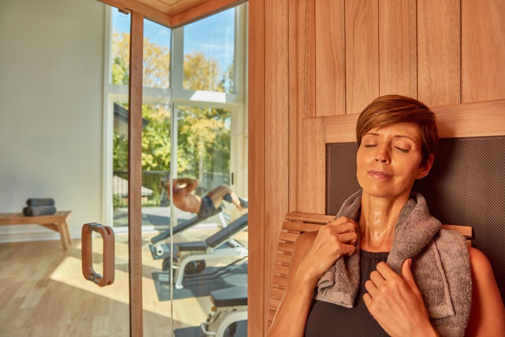 woman sitting in a sauna