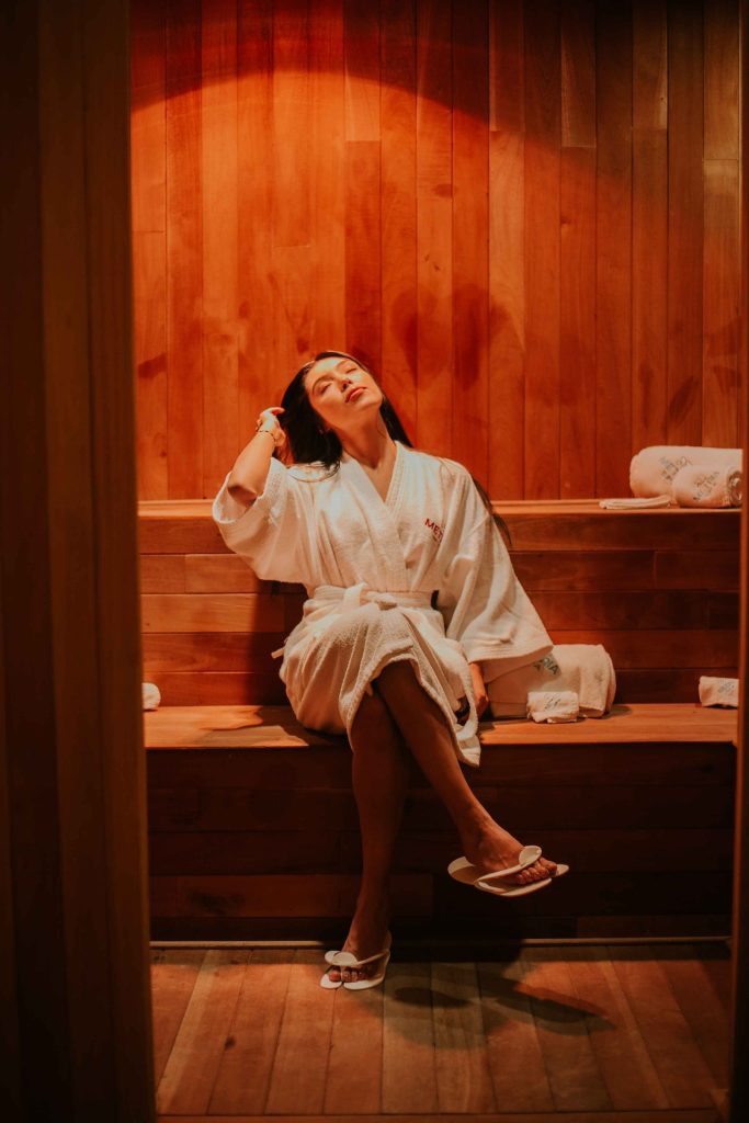 woman relaxing in sauna